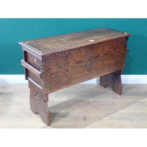 537 - An oak Six Plank Chest with carved front on shaped and carved supports, 2ft 1