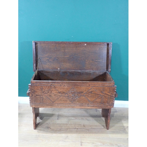 537 - An oak Six Plank Chest with carved front on shaped and carved supports, 2ft 1