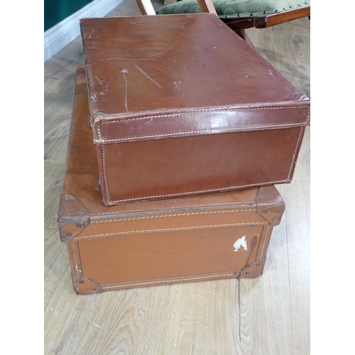 540 - A mahogany framed green upholstered Steamer Chair and two leather Luggage Cases.