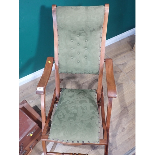 540 - A mahogany framed green upholstered Steamer Chair and two leather Luggage Cases.