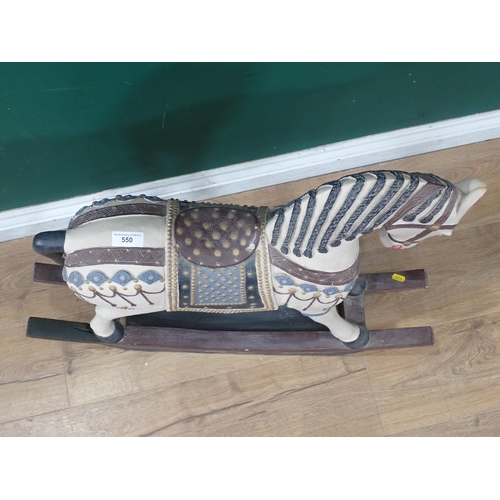 550 - A plaster Rocking Horse model (doesn't rock) with raised painted detail, 2ft 6in L x 2ft 1in H