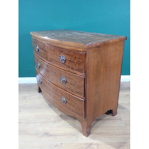 565 - A Bow front mahogany Chest of two short, two long Drawers, above shaped apron and splayed supports A... 