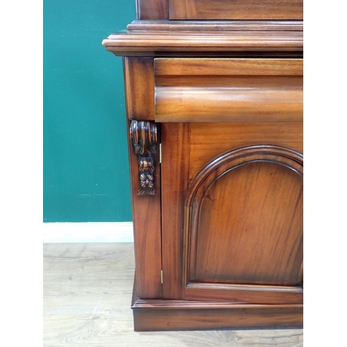 568 - A reproduction mahogany Bookcase, the upper section with pair of glazed cupboard doors enclosing two... 