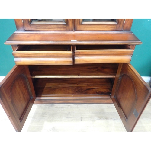 568 - A reproduction mahogany Bookcase, the upper section with pair of glazed cupboard doors enclosing two... 