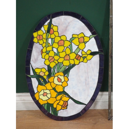 580 - An oval framed stain glass Panel, a rectangular coloured glass Panel, and another with green leafage... 