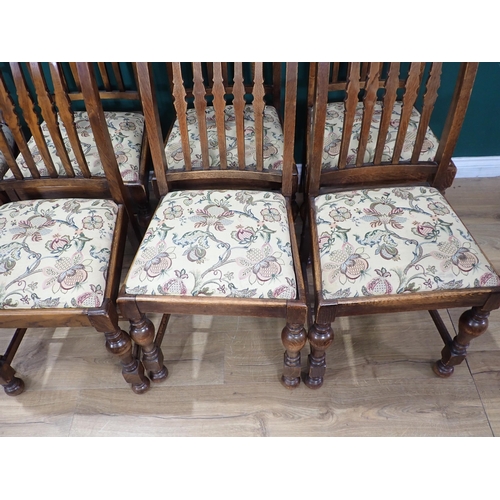 588 - A set of six oak Dining Chairs with floral drop-in seats and a pair of Dining Chairs with rope twist... 