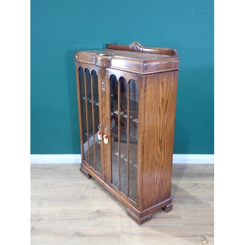 596 - A carved oak glazed Display Cabinet with pair of doors, 3ft 1in H x 3ft 1in W