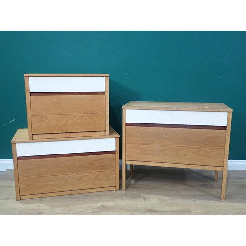 6 - A set of three Chest of Drawers, one on raised legs