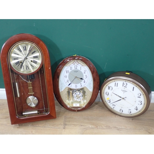 63 - A Small World Rhythm Oval musical Wall Clock, a circular Small World Rhythm musical Wall Clock and a... 