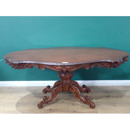 633 - A reproduction mahogany Dining Table on carved and turned column and quadruple platform base, 5ft 8