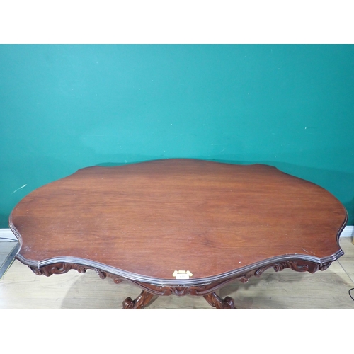 633 - A reproduction mahogany Dining Table on carved and turned column and quadruple platform base, 5ft 8