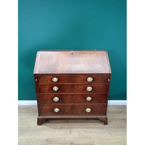 634 - A 19th Century mahogany and crossbanded Bureau, the fall down enclosing drawer and pigeon hole inter... 