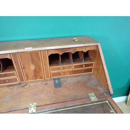 634 - A 19th Century mahogany and crossbanded Bureau, the fall down enclosing drawer and pigeon hole inter... 