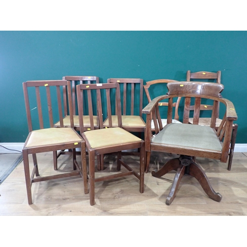 635 - A set of four Dining Chairs with drop in rexine seats, an oak framed Swivel Elbow Chair a Ladderback... 