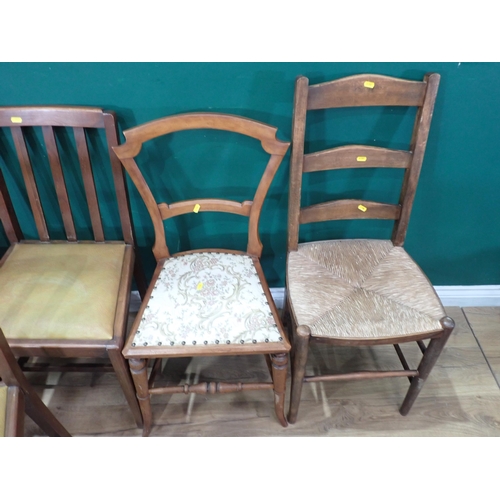 635 - A set of four Dining Chairs with drop in rexine seats, an oak framed Swivel Elbow Chair a Ladderback... 