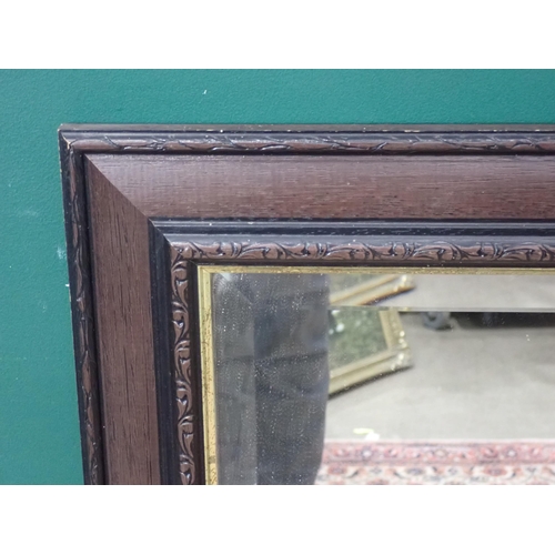 669 - A modern Wall Mirror with bevelled plate.