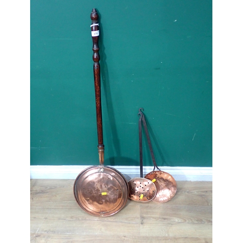 670 - A copper Warming Pan, a copper Chestnut Roaster and a copper Skimmer.