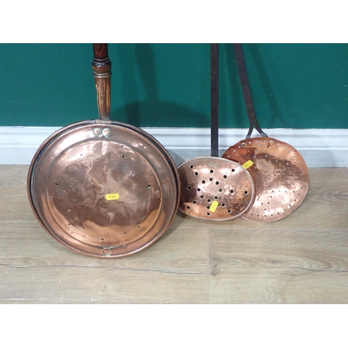 670 - A copper Warming Pan, a copper Chestnut Roaster and a copper Skimmer.