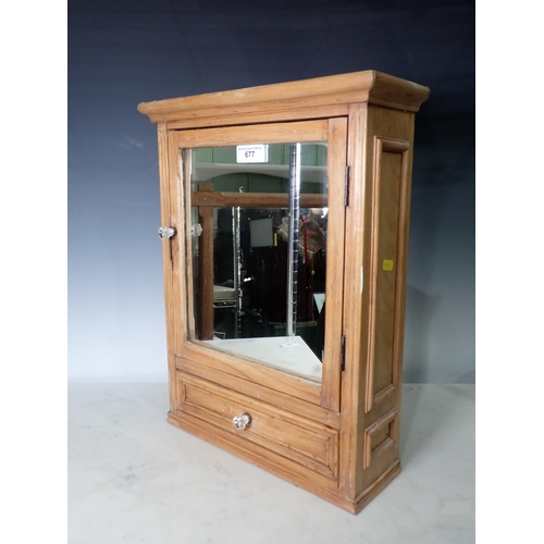 677 - A small pine mirror door Cabinet with single fitted drawer, 1ft 8