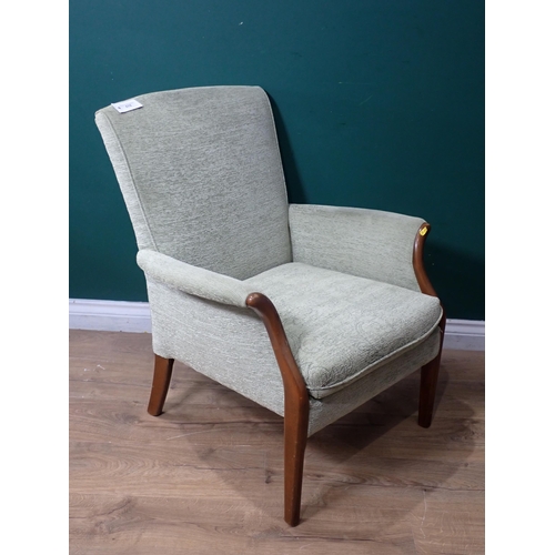 678 - A green floral upholstered Parker-Knoll Elbow Chair.