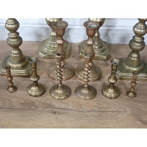 685 - A box of assorted brass Candlesticks.