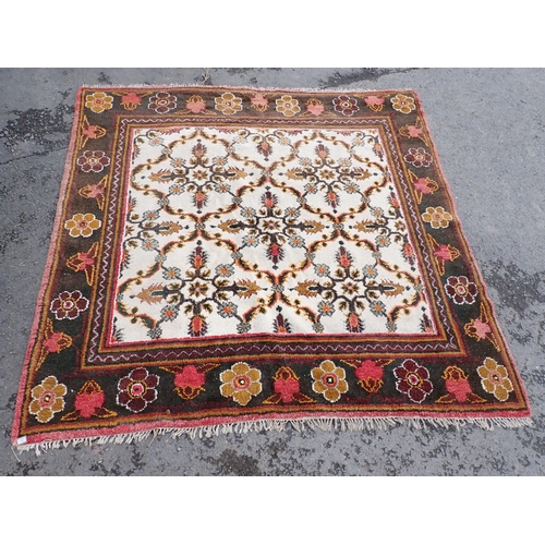 712 - A cream and green ground Rug with floral border and floral central motifs, 9ft 3in x 9ft 1in