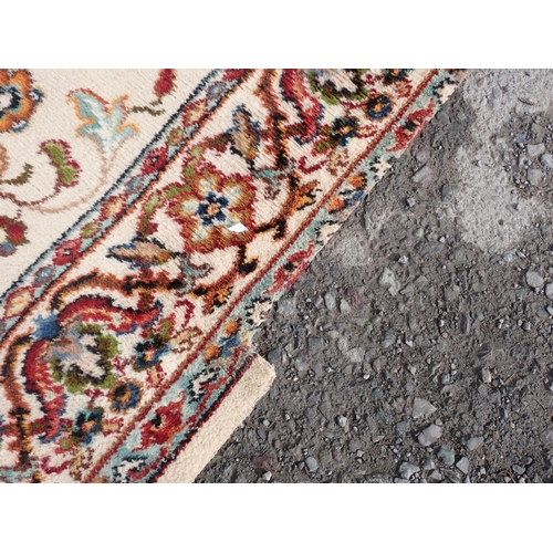 714 - Two modern Persian Rugs on beige ground with multi floral borders, central circular floral motifs, 9... 