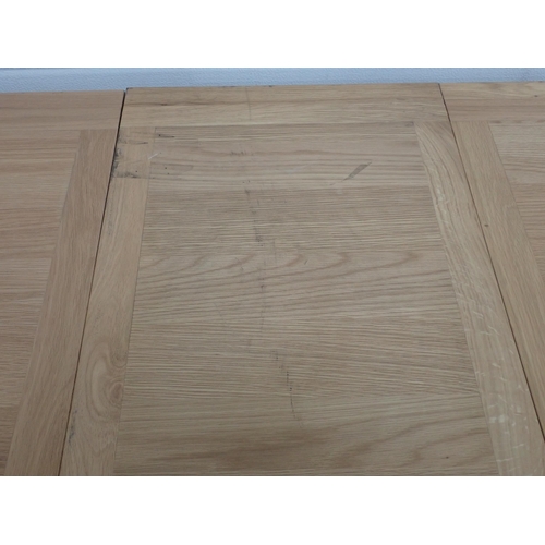 715 - A large modern light oak Dining Table on square supports A/F, 8ft 9