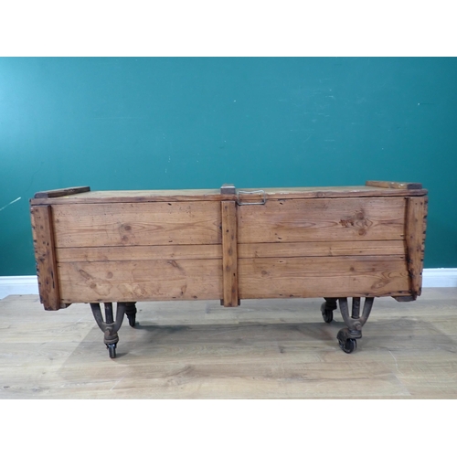 77 - A rustic pine Storage Box on metal supports and castors, 4ft Long x 1ft 11