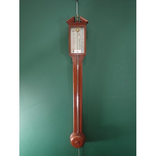81 - A reproduction Stick Barometer and a Cuckoo Clock.