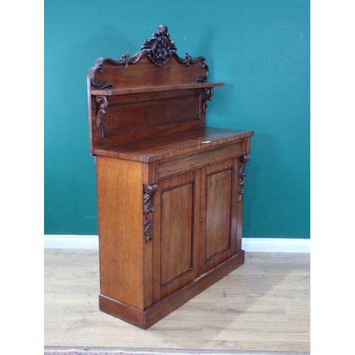 85 - A mahogany Chiffonier with shaped back with single shelf, carved leafage and floral designs, single ... 
