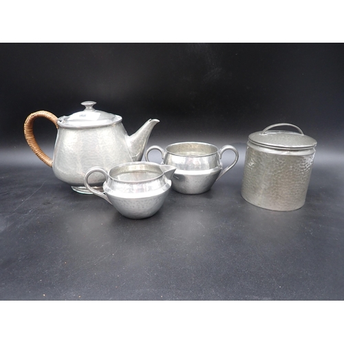 98 - A Tudric pewter three piece Tea Service with hammered design, Teapot 0993, Milk and Sugar 0351, and ... 
