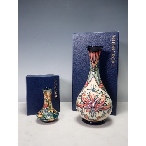 274 - A modern Moorcroft Vase, decorated honeysuckle with slender neck, 9 1/2 in H, boxed, and a small mod... 