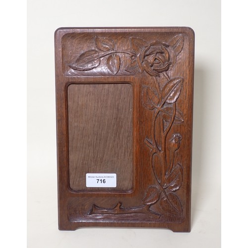 716 - An oak Easel Picture Frame with carved trailing roses and poppies 12in H x 8in W