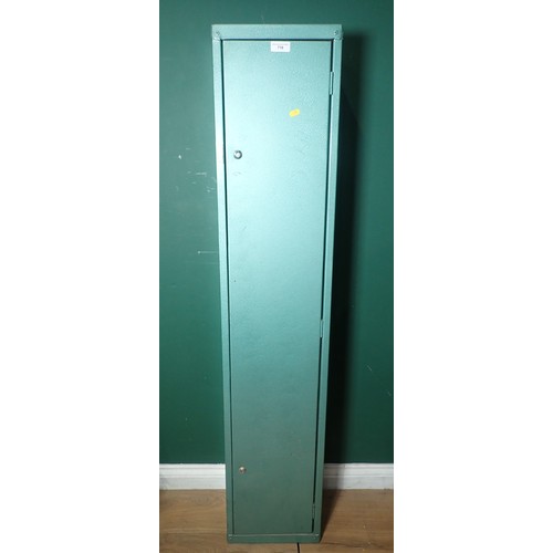 718 - A green painted Gun Cabinet with keys