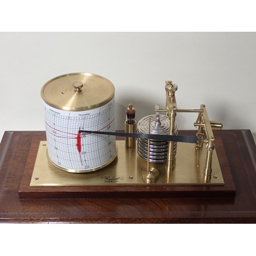 207 - A Barograph in mahogany and glazed case by Russell of Norwich