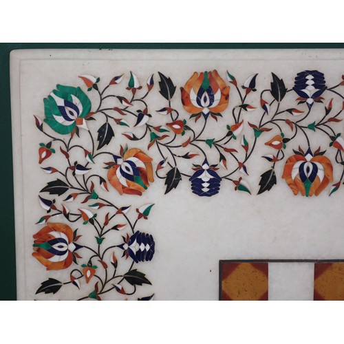 484 - A square Marble Pietra Dura Table Top with chequerboard and floral decorations, 25