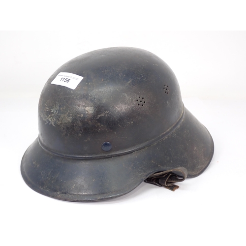 1156 - A WWII German Helmet with partial printed badge