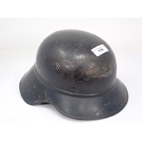 1156 - A WWII German Helmet with partial printed badge