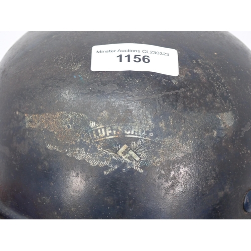 1156 - A WWII German Helmet with partial printed badge