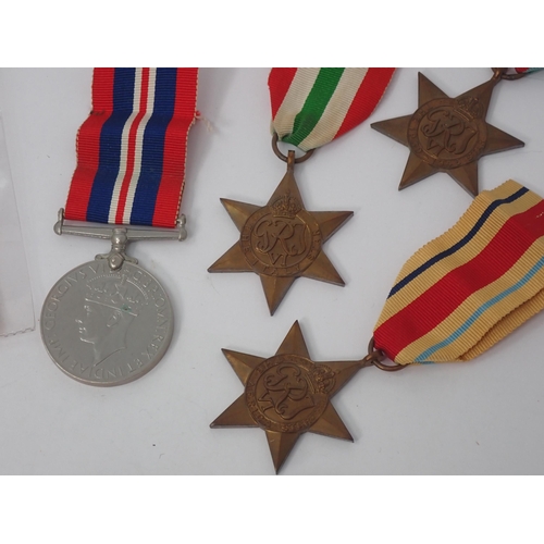 1234 - Four: 1939-45 Star; Africa Star; Italy Star and War Medal, with Condolence Slip and box of issue.

K... 