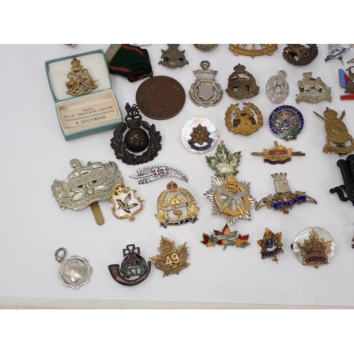 1246 - A quantity of British Army Badges including Royal Marines, Hampshire Yeomanry, Gurkha Transport Regi... 