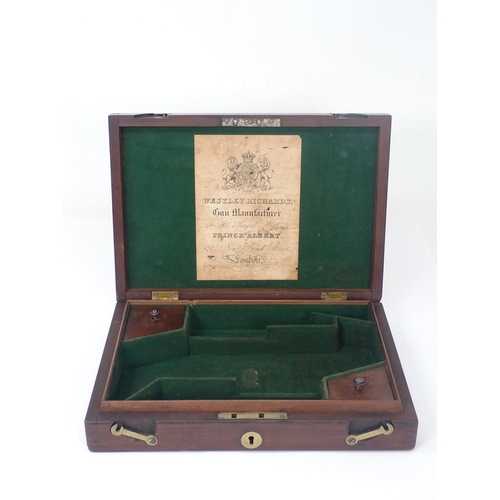 1278 - A Westley Richards mahogany Case for a pair of pistols. The interior is green baise lined and partit... 