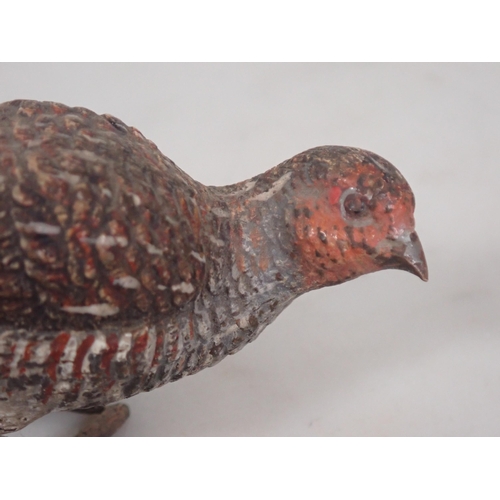 1355 - A cold painted bronze English Partridge, indistinctly signed underneath. 1 1/2