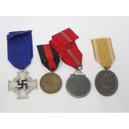 1430 - Four WWII German Medals including 25 Year Long Service, Liberation of Sudetenland, West Wall Medal a... 