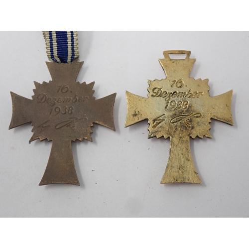 1438 - A Nazi Mother's Cross in gold and bronze with ribbons, both in excellent original condition