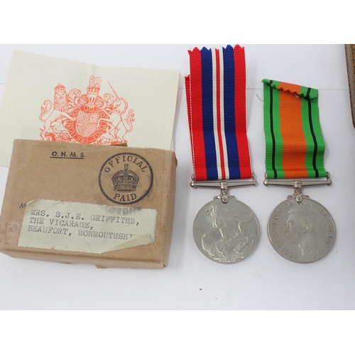 1476 - A WWII War and Defence Medal in box of issue with medal slip to Mrs S.J.E. Griffiths and Miniatures ... 