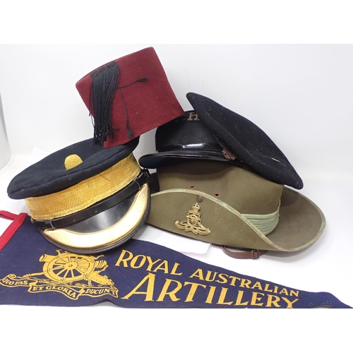 1489 - A box of Military Caps and Hats including Royal Horse Artillery, Hong Kong Police, Royal Australian ... 