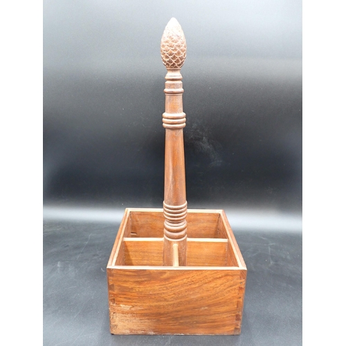 438 - A hardwood four division Bottle Holder with central handle having carved finial, 18in