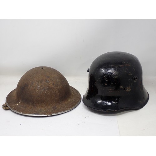 1481 - A box of assorted Militaria including WWII German Helmet, Kukris, WWII British Helmet, semi relic Fr... 